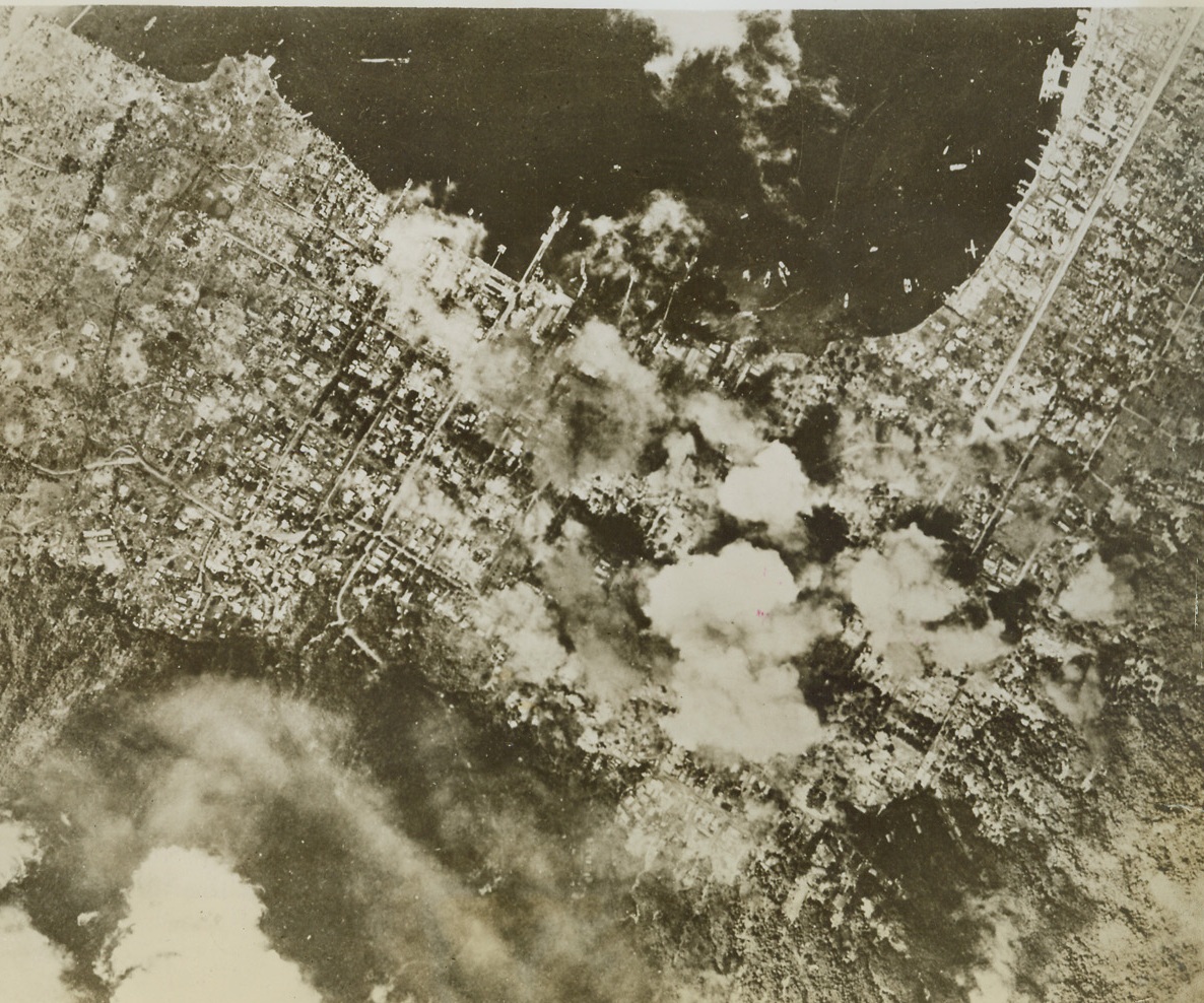 Bombs Blast City of Raboul, 3/26/1944. Raboul – Bombs explode in heart of city of Raboul, New Britain, Japanese staging and supply base in Southwest Pacific during a recent raid. Credit: Official U.S. Navy photo from ACME;