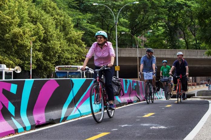 Image of a painted concrete wall protecting a two-way cycle track.