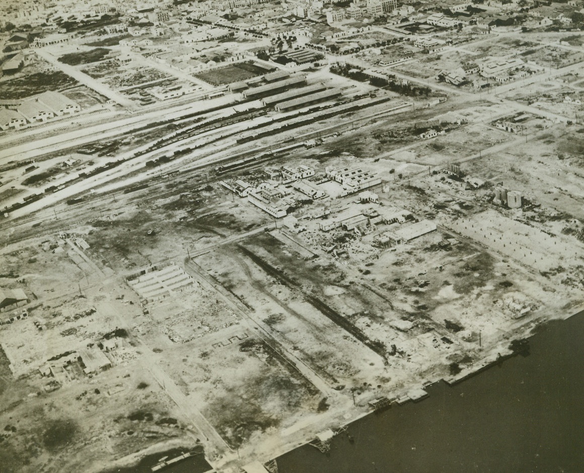 What Allies Did to Tunis, 5/22/1943. Tunis—Acres and acres of bombed docks, with warehouses and installations completely knocked out, are shown in this photo of Tunis, taken by RAF photographers soon after the city was occupied by the Allies. Although the center of the town was left almost intact by raiders, Tunis military objectives took a bad beating from the air.Credit: ACME.;