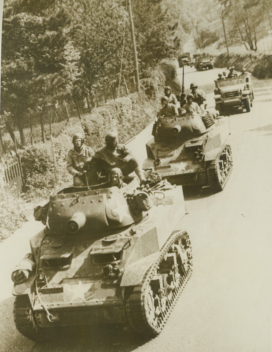 Move to Jump-off Positions, 5/22/1944. England – A U.S. army convoy winds its way along a country road in England to an unknown destination. Allied mobile might has been clogging the roads and lanes of rural England on the move from their bases possibly to points from which they will cross the Channel to play their parts in the liberation of Nazi-held Europe. Credit: (ACME);