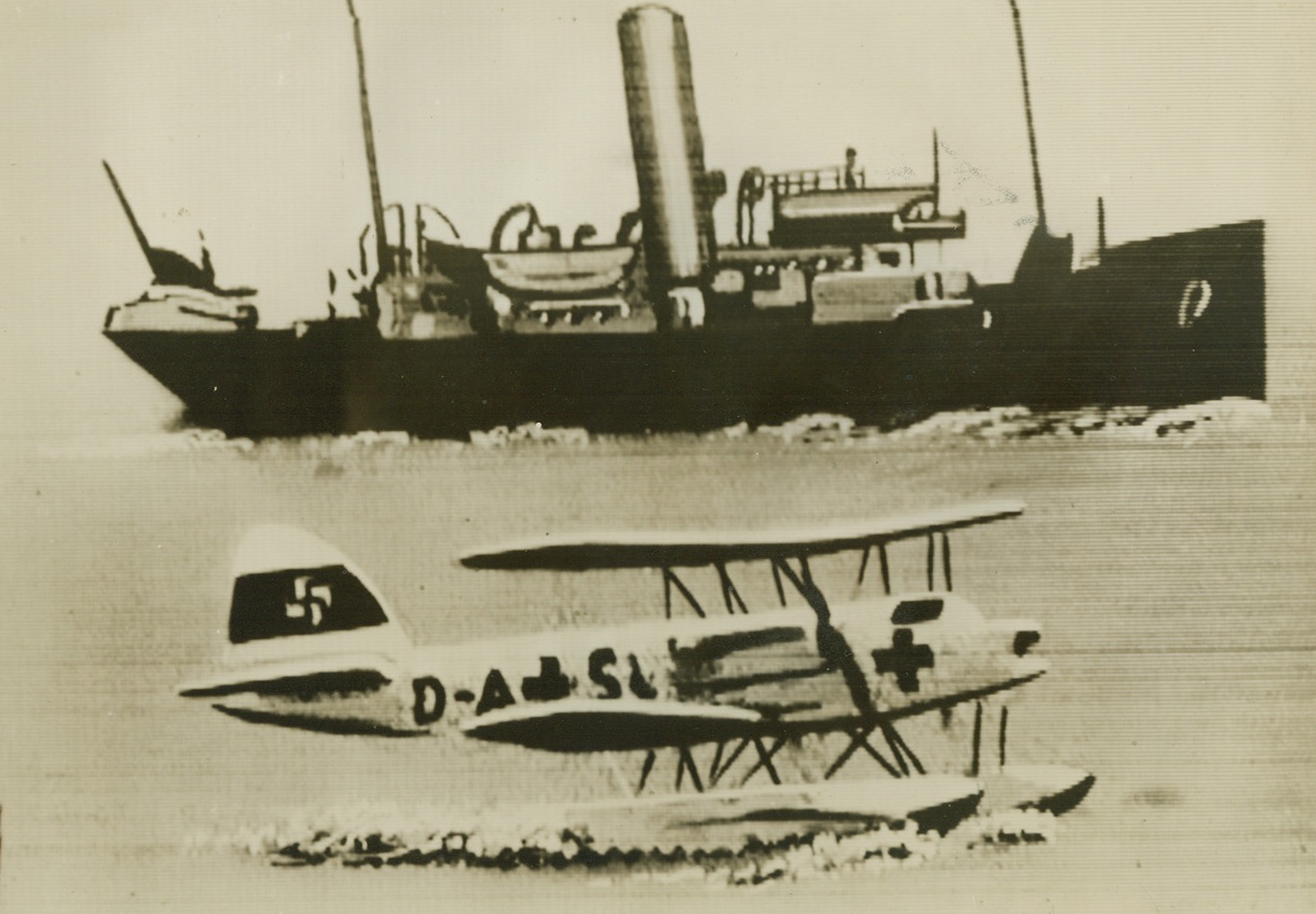 CAPTURE NAZI PLANE DISGUISED WITH RED CROSS, 7/30/1940  LONDON – A German seaplane marked with the Red Cross down on the sea after being captured by the British royal air force, who shot down two such planes yesterday.  According to British authorities German planes bearing the Red Cross have been making scouting flights over British convoys and doing other reconnaissance work in violation of international law, and henceforth would operated near the British Isles at their own risk.  In the background is the boat that picked up the crew of the German plane.  Passed by British censor and sent to New York by Western Union cabel, July 30th.Credit: Acme;