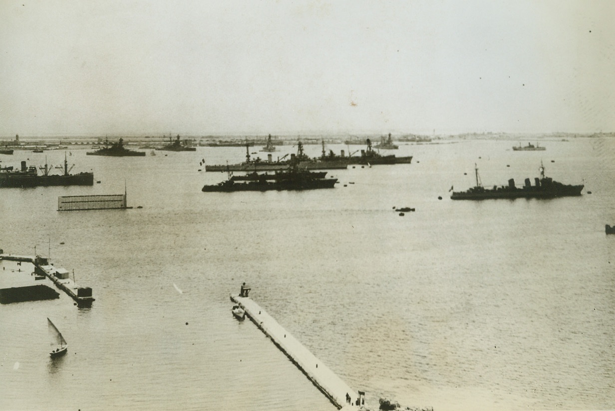 French Egyptian Fleet to Come to New York, 5/31/1943. London – French warships at Alexandria (shown above), which have been lying immobilized since the Fall of France three years ago, have com under the allied control, according to a Berlin radio report last night.  The report, not immediately confirmed by any allied source, quoted a Vichy French Government announcement which said that the fleet “had given in to American and British pressure” and that “crewmen said they would join the allies.”  One battleship, four cruisers, three destroyers, one submarine and a number of small auxiliary vessels make up the Alexandria fleet.Credit line (ACME);