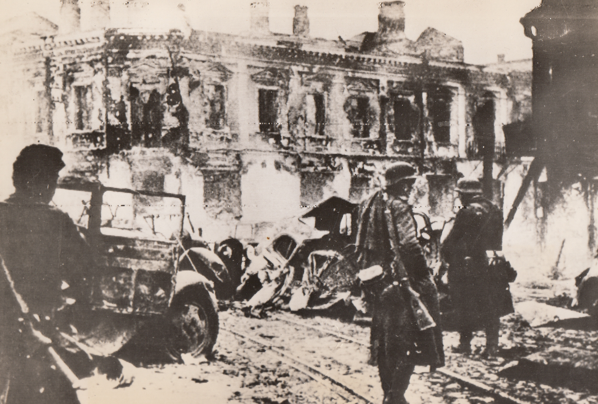 Brief Visit, 1/7/1944. Zhitower, U.S.S.R.—Launching their counter-offensive against the Kiev salient, the Germans tasted success briefly when they re-occupied battered Zhitomer. In this photo, received in London through a neutral source, Nazi infantrymen survey the city’s ruined streets.;