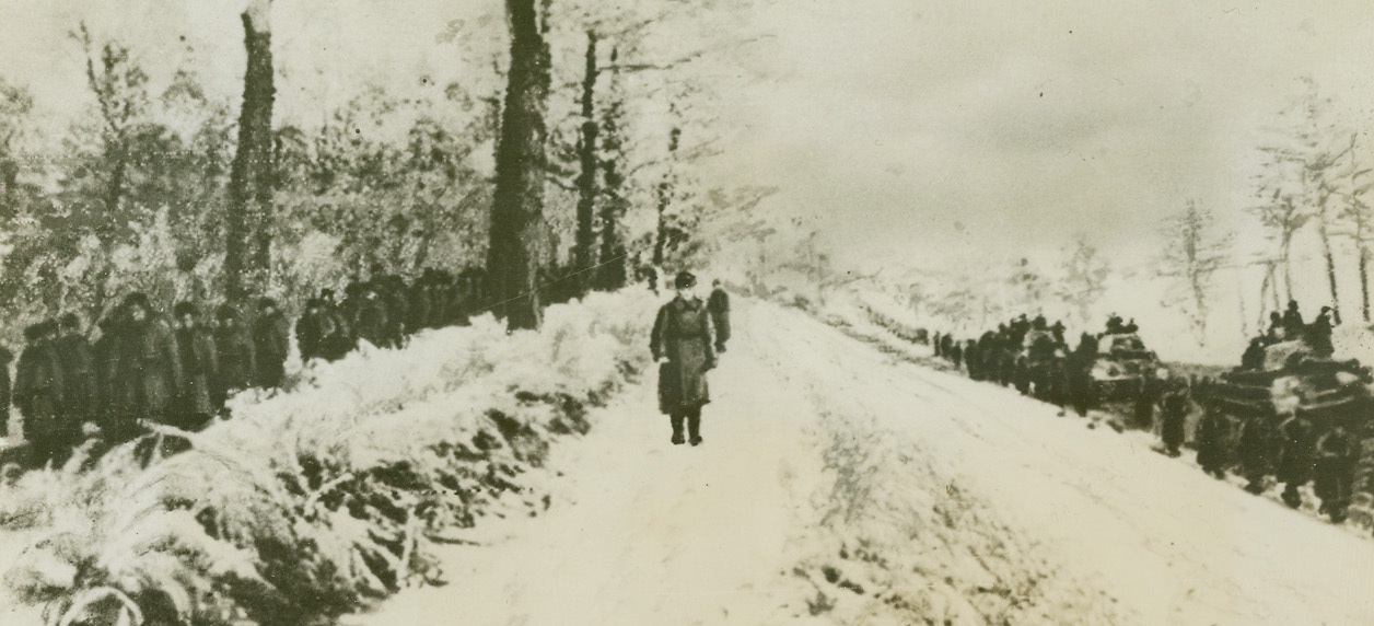 Long Cold Road to Revenge, 1/24/1944. Russia—As far as the eye can see, long columns of General Vatutin’s first Ukranian Army move westward on a frozen road on the Sarny battlefront in pre-war Poland. This is the first photo of the advance on an 80 mile front where desperately stiffened Nazi resistance is being broken. Credit: ACME.;