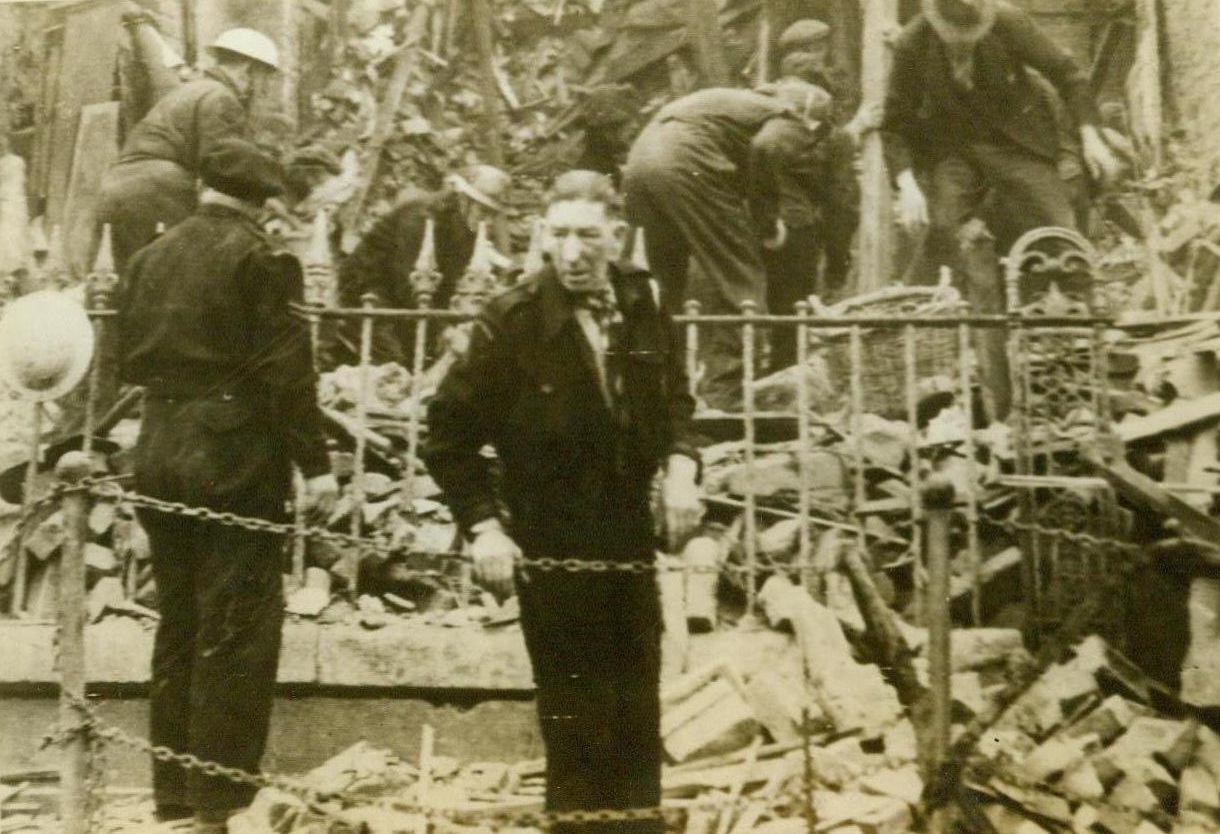 Hit by pilotless plane, 6/16/1944. ENGLAND – In a desperate effort to stem the tide of warfare, swinging in the favor of the Allies in France, Hitler sent his “secret weapon” – robot planes – on its mission of destruction in England. Rescue workers search the debris of this wrecked house in southern England for buried family. Yesterday flocks of the ghostly, pilotless planes bombed Britain. CREDIT (Signal Corps Radiotelephoto from ACME) 6/1/44;