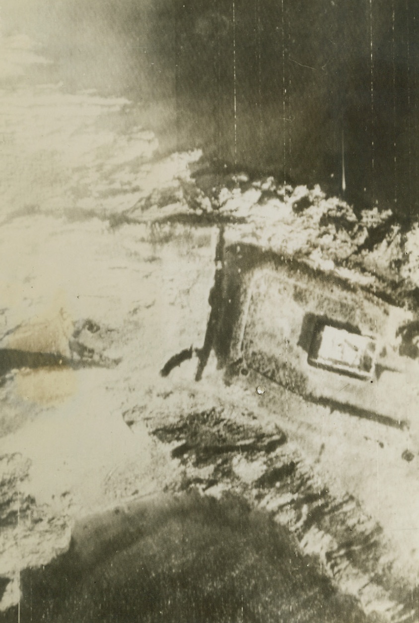Abandoned Fortification, 6/14/1944. France—Taken from a photo plane of the Ninth Air Force, this radiotelephoto shows an abandoned German fortification somewhere on the northern coast of France. A moat can be seen surrounding the fort. Credit: 9th USAAF photo transmitted by Signal Corps radiotelephoto from London from ACME.;