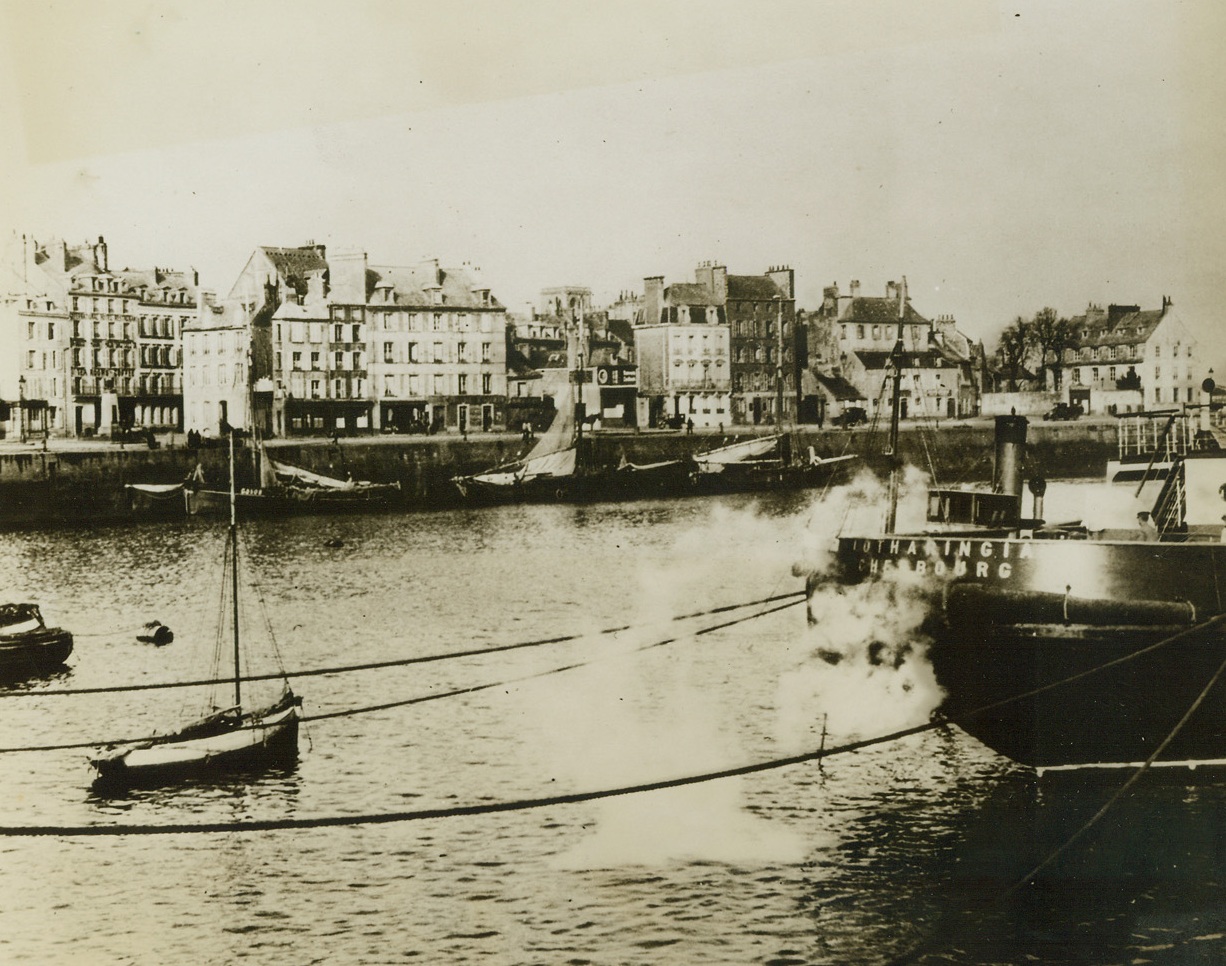 INVASION COASTLINE EXTENDS TO CHERBOURG, 6/6/1944. Combined Anglo-American landing operations—one launched from the sea and the other from the air—against the coast of western Europe early this morning (June 6th) covered the entire coastline from LeHavre to Cherbourg in France. Here is a peacetime scene in quiet Cherbourg harbor. Credit Line (ACME);