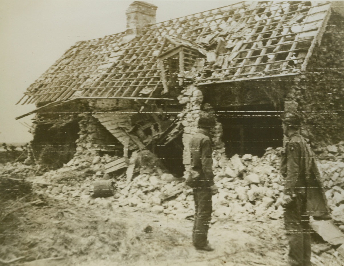 SNIPER’S NEST, 6/12/1944. SOMEWHERE IN FRANCE—Once the cozy nest in which a treacherous Nazi sniper hid himself, this building in Normandy was blown to bits by doughboys advancing overland through France. Latest communiqués from the front indicate that vital Carentan has fallen to the Allies and that American troops have driven 18 miles inland from the center of the French beachhead in a swift advance that threatens the entire German left flank. Credit (Signal Corps Radiotelephoto from ACME);