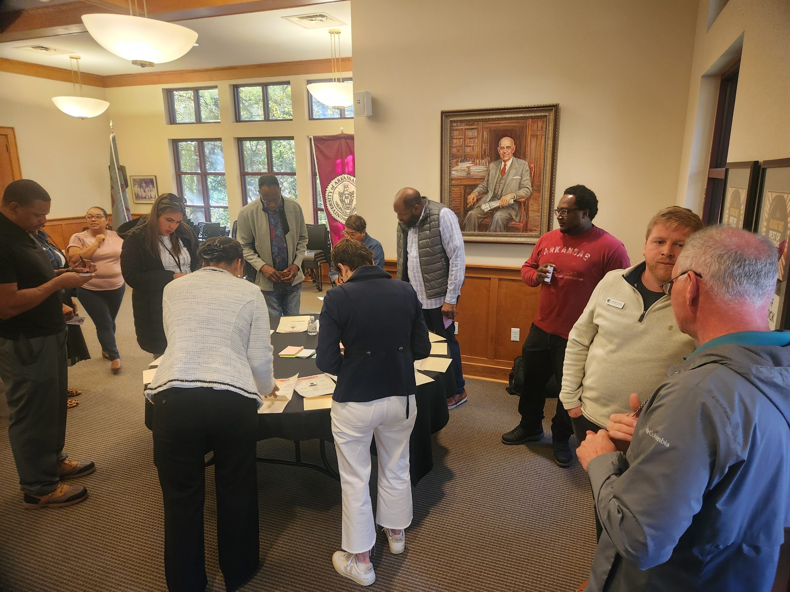 Woman speaking at podium with people paying attention to her. 