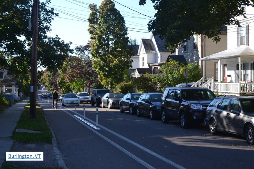 Physically protected bike lane in a historic Vermont neighborhood... that's likely a 10 ft. vehicular lane (Question #18).